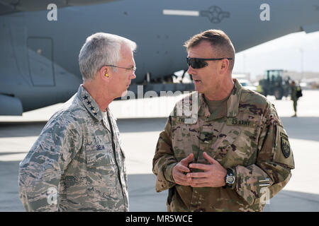 U.S. Air Force Gen. Paul J. Selva, Vice Chairman of the Joint Chiefs of Staff, speaks with U.S. Army Maj. Gen. John C. Thomson III, 1st Cavalry Division Commanding General, upon arrival at Bagram Airfield, Afghanistan, March 30, 2017. Gen. Selva, along with USO entertainers, visited service members who are stationed outside the continental U.S. at various locations across the globe.  This year’s entertainers included country musician Craig Morgan, mixed-martial artist Dominick Cruz, chef Robert Irvine, U.S. Olympic Swimmer Katie Meili, and mentalist Jim Karol. (DoD Photo by U.S. Army Sgt. Jame Stock Photo