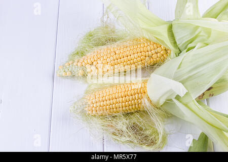 fresh corns on the wooden white background Stock Photo