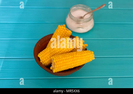 Boiled corn on a blue wood background Stock Photo
