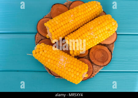 Boiled corn on a blue wood background Stock Photo