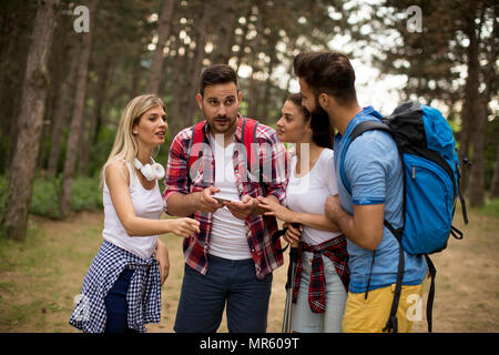 Group of young people hiking in mountain at spring day Stock Photo