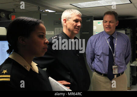 Philadelphia, Pa. (May 15, 2017) – Vice Adm. Thomas J. Moore, commander of Naval Sea Systems Command (NAVSEA), and Lt. Mellany George NAVSEA mentee, with Andy Cairns, DDG 51 Land Based Engineering Site (LBES) manager, on a tour of the facilities at NSWC Philadelphia in Philadelphia May 11, 2017. The tour consisted of numerous informative stops with subject matter experts throughout the base. (U.S. Navy photo by Petty Officer 1st Class Richard Hoffner/Released) Stock Photo