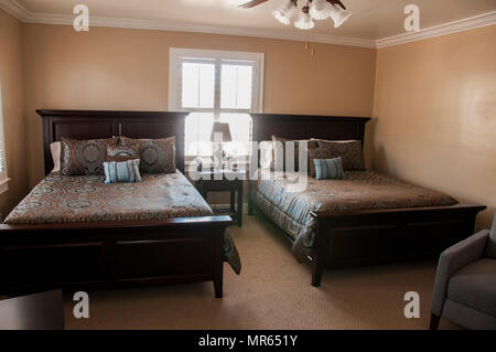 Zachary and Elizabeth Fisher House provides lodging accommodations for families of service members receiving medical care. The archival image documents a bedroom with two queen-size beds at the William Beaumont Army Medical Center Fisher House following reopening after renovation on May 12. Stock Photo