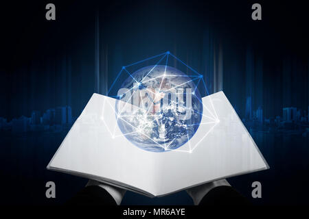 Hand opened book and global with network connection. Elements of this image are furnished by NASA Stock Photo