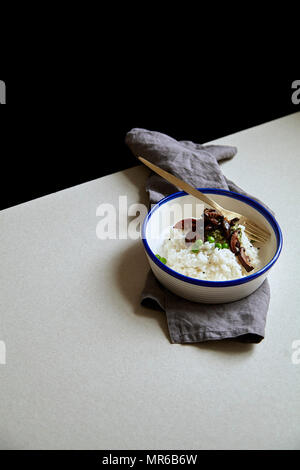 Comfort food bowl with jasmin rice, shiitake mushrooms and green peas Stock Photo
