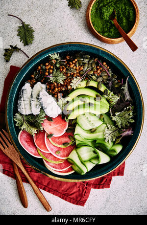 Healthy salad: watermelon raddish, ash coated goat cheese, avocado, baby kale Stock Photo