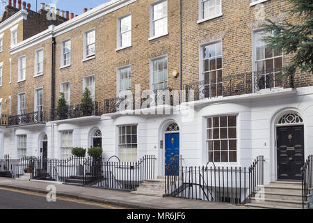 Stucco fronted facades of upmarket residential townhouses in Alexander ...