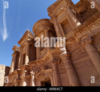 Photo taken at an oblique angle of a section of Al-Deir, the so-called monastery, in the necropolis of Petra, Jordan Stock Photo