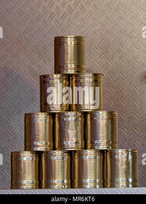 Pyramid of ten tin cans without banderole, which are put together at the fair to form a pyramid to be folded over, germany Stock Photo