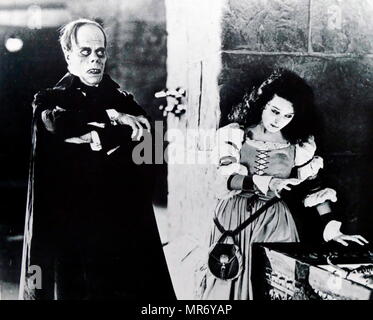 Lon Chaney and Mary Philbin in 'The Phantom of the Opera' a 1925 American silent horror film adaptation of Gaston Leroux's 1910 novel, directed by Rupert Julian and starring Lon Chaney, Sr. in the title role. Lon Chaney (1883 – 1930); American stage and film actor, make-up artist, director and screenwriter. renowned for his characterizations of tortured, often grotesque and afflicted characters, and his ground-breaking artistry with makeup. Mary Loretta Philbin (1902 – 1993); American film actress of the silent film era Stock Photo