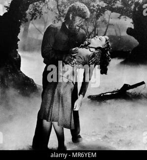 Lon Chaney and Evelyn Ankers in 'The Wolf Man' a 1941 American horror film written by Curt Siodmak and produced and directed by George Waggner. The film features Lon Chaney Jr. in the title role, and also features Claude Rains, Warren William, Ralph Bellamy, Patrick Knowles, and Bela Lugosi; with Evelyn Ankers, and Maria Ouspenskaya in supporting roles Stock Photo