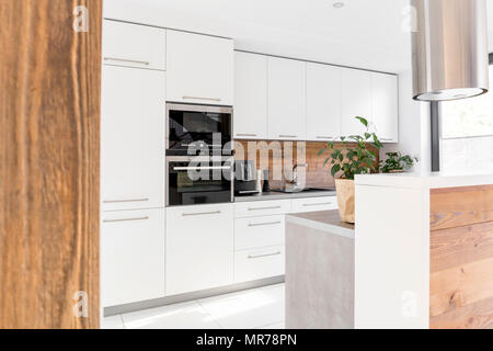 Modern white kitchen with island and white furniture