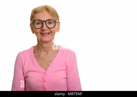 Happy senior nerd woman smiling and laughing while wearing geeky Stock Photo