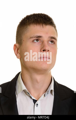 Face of young businessman thinking Stock Photo