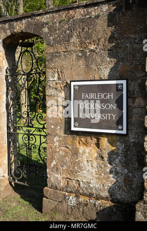 An old entrance gate sign to Fairleigh Dickinson University, formerly Wroxton College at Wroxton, near Banbury, Oxfordshire Stock Photo