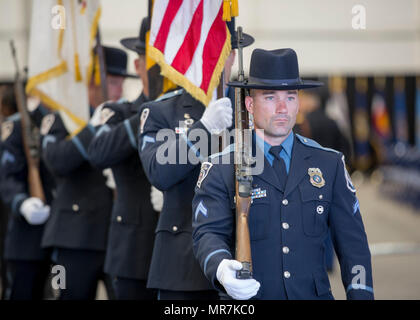 The Anne Arundel County Police present their colors during the 31st Annual Massing of the Colors, Fort George G. Meade, Md., May 21, 2017. Massing of the Colors is a patriotic ceremony that combines colors and color guards of Active, Reserve, and National Guard military components as well veteran, civic, and patriotic organizations. (U.S. Army photo by Spc. Tianna S. Wilson) Stock Photo