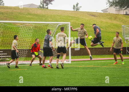 British Soldiers assigned to 3rd (United Kingdom) Division Signal Regiment attempt to defend the first scored goal from Paratroopers assigned to 1st Battalion, 505th Parachute Infantry Regiment, 3rd Brigade Combat Team, 82nd Airborne Division during the championship soccer game of the All American Week 100 soccer tournament at Towle Stadium on Fort Bragg, N.C., May 23, 2017. (Army photo by Sgt. Steven Galimore) Stock Photo