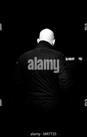 A security guard looks out of the cinema during French Film Week at the Kino International, Berlin, Germany. Stock Photo