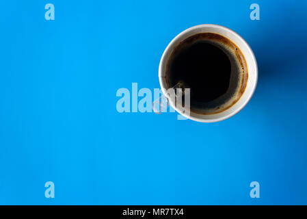 Instant coffee in paper cup on light blue pastel background Stock Photo