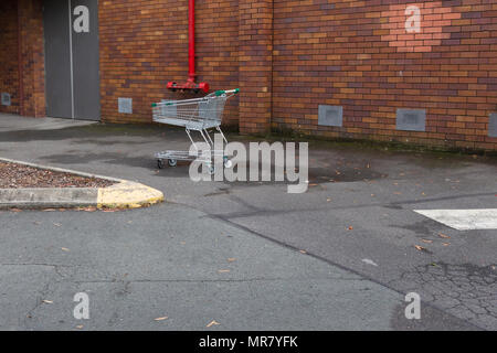 Shopping cart found abandoned in carpark Stock Photo