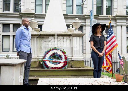 Cast members Brandon Victor Dixon (Aaron Burr) and Lexi Lawson (Eliza Hamilton) of the esteemed Broadway musical, Hamilton attend a wreath-laying ceremony for the founder of the Coast Guard, Alexander Hamilton, at his gravesite on the grounds of Trinity Church, in New York City, May 26, 2017. The wreath-laying ceremony was part of Fleet Week New York and Memorial Day weekend activities. U.S. Coast Guard photo by Petty Officer 1st Class LaNola Stone. Stock Photo