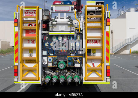 The rear od a fire engine with the various dials and equipment controls