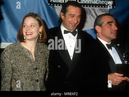 LOS ANGELES, CA - MARCH 22: (L-R) Actress Jodie Foster, actor Robert DeNiro and director/honoree Martin Scorsese attend the Sixth Annual American Cinematheque Salute to Martin Scorsese on March 22, 1991 at the Century Plaza Hotel in Los Angeles, California. Photo by Barry King/Alamy Stock Photo Stock Photo