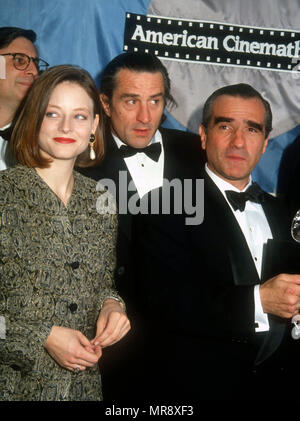 LOS ANGELES, CA - MARCH 22: (L-R) Actress Jodie Foster, actor Robert DeNiro and director/honoree Martin Scorsese attend the Sixth Annual American Cinematheque Salute to Martin Scorsese on March 22, 1991 at the Century Plaza Hotel in Los Angeles, California. Photo by Barry King/Alamy Stock Photo Stock Photo