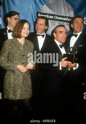 LOS ANGELES, CA - MARCH 22: (L-R) Actress Jodie Foster, actor Robert DeNiro, director/honoree Martin Scorsese and director Sydney Pollack attend the Sixth Annual American Cinematheque Salute to Martin Scorsese on March 22, 1991 at the Century Plaza Hotel in Los Angeles, California. Photo by Barry King/Alamy Stock Photo Stock Photo