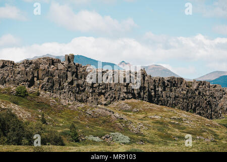 Spectacular Rocky Mountains With Green Vegetation And Small River In 