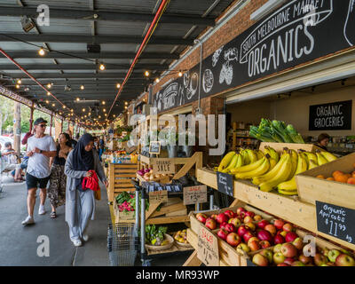 Organic groceries on display and being sold at stall in South Melbourne market, Melbourne, Victoria, Australia.South Melbourne market is a popular and Stock Photo