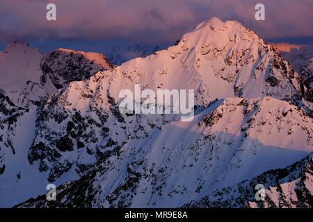 Sunset light on Eagle Peak in the Chugach Mountains of Alaska Stock Photo