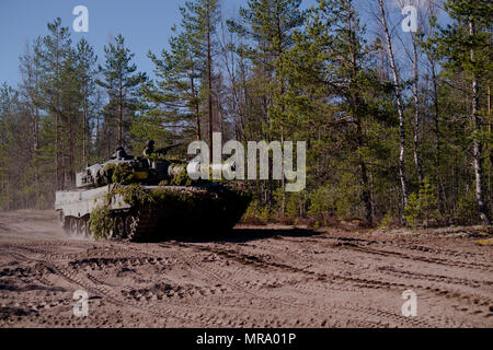 Finnish Soldiers of the Armoured Brigade, drive their tank during a training mission in Pohjankangas, Niinisalo, Finland, May 6, 2017. The Finnish, alongside U.S. and Norwegian Soldiers, participated in Arrow 17, an annual Finnish training exercise that enhances interoperability and the capability of mechanized, motorized and armoured units to perform tactical manoeuvres together. (U.S. Army photo by Spc. Elliott Banks) Stock Photo