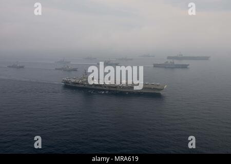 170601-N-OY799-1389 SEA OF JAPAN (June 1, 2017) The Carl Vinson strike group, including USS Carl Vinson (CVN 70), Carrier Air Wing (CVW) 2, guided-missile cruiser USS Lake Champlain (CG 57) and guided-missile destroyers USS Wayne E. Meyer (DDG 108) and USS Michael Murphy (DDG 112), operates with the Ronald Reagan strike group including, USS Ronald Reagan (CVN 76), Carrier Air Wing (CVW) 5, guided-missile cruiser USS Shiloh (CG 67), guided-missile destroyers USS Barry (DDG 52), USS McCambell (DDG 85), USS Fitzgerald (DDG 62), and USS Mustin (DDG 89) and the Japanese Ships (JS) Hyuga (DDH 181) a Stock Photo