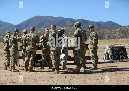 U.S. Army Soldiers competing in the 2017 Network Enterprise Technology (NETCOM) Best Warrior Competition, take a break after zeroing their M-4 rifles during range familiarization at Fort Huachuca, Az., May 12, 2017. The competition is a grueling week-long event that test the skills, knowledge and professionalism of Soldiers representing NETCOM's subordinate organizations from around the globe. (U.S. Army photo by Spc. Quince C. Lanford) Stock Photo