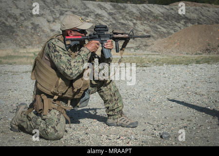 Gunner’s Mate 1st Class Erik Davila, right, Chief Mass Communication ...