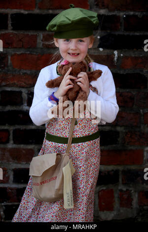 Bury, UK, 26 May 2018. A young girl dressed as a child evacuee outside the East Lancashire Railway,(permission given for editorial use) Bury,Lancashire, 26th May, 2018 (C)Barbara Cook/Alamy Live News Stock Photo