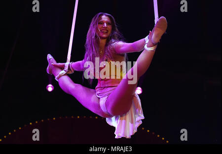 25 May 2018, Germany, Duesseldorf: The aerialist Adele Fame performing in the evening of the premiere of the 'Circus Roncalli' at the Rheinpark under the headline 'Storyteller: Yesterday-Today-Tomorrow'. Clowns, magicians and performers will be able to enthrall circus lovers from 25 May until 24 July 2018. However, animals such as horses, elephants and fish will only participate as holograms. Photo: Horst Ossinger//dpa Stock Photo
