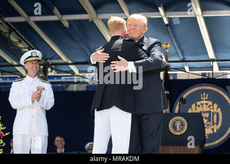 Annapolis, MD- WEEK OF MAY 21: President Donald J. Trump congratulates graduates at the 2018 U.S. Naval Academy Graduation and Commissioning ceremony, where he addressed 1,042 newly commissioned ensigns and second lieutenants, at the Navy Marine Corps Memorial Stadium, Friday, May 25, 2018, in Annapolis, MD.    People:  President Donald Trump Stock Photo