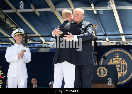Annapolis, MD- WEEK OF MAY 21: President Donald J. Trump congratulates graduates at the 2018 U.S. Naval Academy Graduation and Commissioning ceremony, where he addressed 1,042 newly commissioned ensigns and second lieutenants, at the Navy Marine Corps Memorial Stadium, Friday, May 25, 2018, in Annapolis, MD.    People:  President Donald Trump Stock Photo