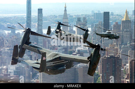 WASHINGTON, DC - WEEK OF MAY 21: Joined by support aircraft, Marine One, with President Donald J. Trump aboard, flies above the New York City skyline, Wednesday, May 23, 2019, en route to the Wall Street landing zone in New York City  People:  President Donald Trump Stock Photo