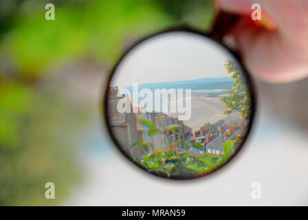 Portland. 26 May 2018. The shape of sunny Chesil Beach still looks familiar when inverted by a magnifying glass. Correct in the edit and all becomes clear Credit: stuart fretwell/Alamy Live News Stock Photo