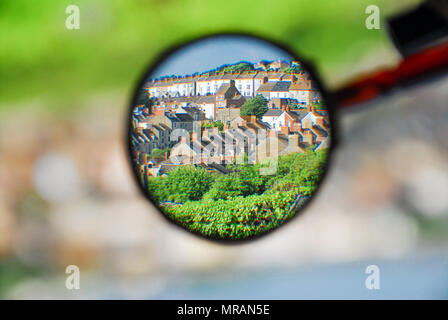 Portland. 26 May 2018. The sun-bathed village of Fortuneswell, Isle of Portland, seems to be suspended in space when seen through a magnifying glass Credit: stuart fretwell/Alamy Live News Stock Photo