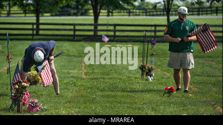 UNITED STATES: May 26, 2018: James Grenier and Daniell of American Legion Baseball volunteer at Union Cemetery in Leesburg during a day of flagging veterans graves. The next two days members of the SCV, Veterans of Foreign Wars, Daughters of the American Revolution, American Legion, Scouts, American Legion Baseball teams and other organizations will set flags on all graves across Loudoun for Memorial Day on Monday. (Photo by Douglas Graham/Loudoun Now) Credit: William Graham/Alamy Live News Stock Photo