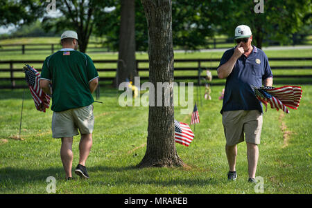 UNITED STATES: May 26, 2018: Daniell and James Grenier of American Legion Baseball volunteer at Union Cemetery in Leesburg during a day of flagging veterans graves. The next two days members of the SCV, Veterans of Foreign Wars, Daughters of the American Revolution, American Legion, Scouts, American Legion Baseball teams and other organizations will set flags on all graves across Loudoun for Memorial Day on Monday. (Photo by Douglas Graham/Loudoun Now) Credit: William Graham/Alamy Live News Stock Photo