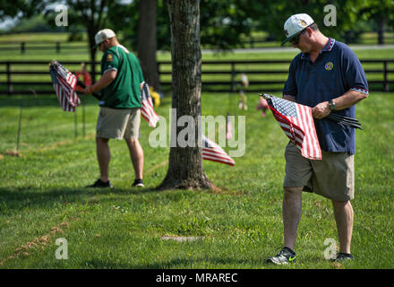 UNITED STATES: May 26, 2018: Daniell and James Grenier of American Legion Baseball volunteer at Union Cemetery in Leesburg during a day of flagging veterans graves. The next two days members of the SCV, Veterans of Foreign Wars, Daughters of the American Revolution, American Legion, Scouts, American Legion Baseball teams and other organizations will set flags on all graves across Loudoun for Memorial Day on Monday. (Photo by Douglas Graham/Loudoun Now) Credit: William Graham/Alamy Live News Stock Photo