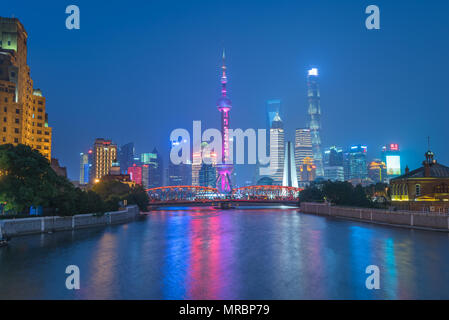 Famous skyline of Pudong in Shanghai, China with many landmark buildings along the Huangpo River including the Pearl Tower Stock Photo