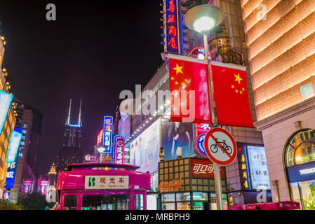 Night scene of the brightly lit shopping street of East Nanjang Road in Shanghai the largest city in China Stock Photo