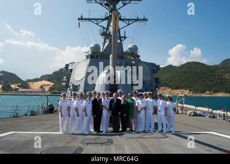 170602-N-XK398-106 CAM RANH INTERNATIONAL PORT, Vietnam (Jun. 02, 2017) Senators John S. McCain III, Christopher Coons, and John Barrasso stand in front of the Mark 45 5-inch for a group photo during a visit to the Arleigh Burke-class guided-missile destroyer USS John S. McCain (DDG 56). The U.S. Navy has patrolled the Indo-Asia-Pacific routinely for more than 70 years promoting regional peace and security. (U.S. Navy photo by Mass Communication Specialist 3rd Class Joshua Mortensen/Released) Stock Photo