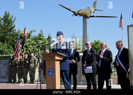 Col. Brian May, commander of the 403rd Operation Group, gives a speech during a ceremony in Picauville, France. This ceremony commemorates the 73rd anniversary of D-Day, the largest multi-national amphibious landing and operational military airdrop in history, and highlights the U.S.' steadfast commitment to European allies and partners. Overall, approximately 400 U.S. service members from units in Europe and the U.S. are participating in ceremonial D-Day events from May 31 to June 7, 2017(U.S. Air Force photo by Staff Sgt. Nicholas Monteleone) Stock Photo